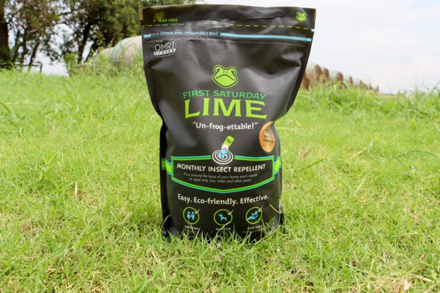 A bag of First Saturday Lime sitting on green grass.