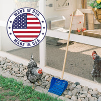 Blue coop scoop leaned against a chicken coop with a badge that says "made in USA."